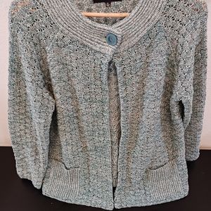 Jones of New York green sweater with round neck with one button also with pocket